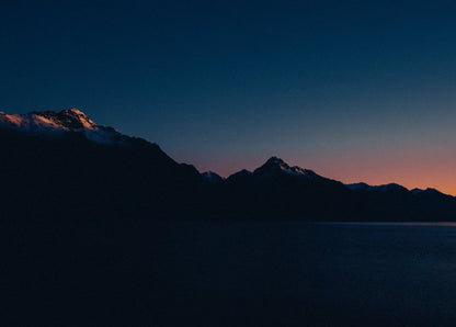 Twilight Lake and Mountain Silhouettes