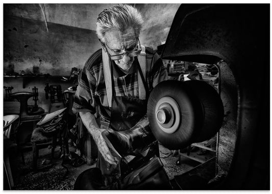 Old Shoemaker at Work