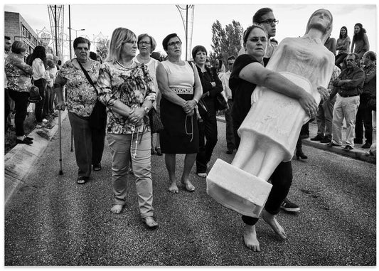 Barefoot Woman Carrying Statue