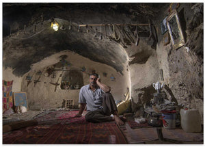 Pensive Man in Cave Home