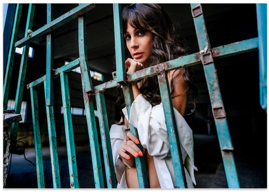 Woman Behind Green Bars