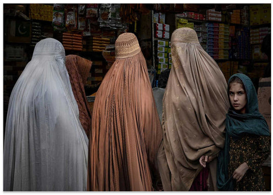 Girl and Veiled Women