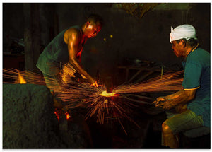 Blacksmith At The Forge